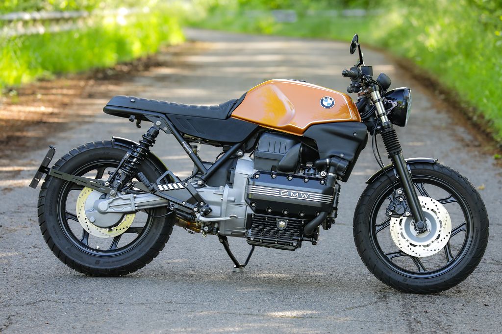 BMW K100 SE Roadster bike in vintage design parked on a scenic road, showcasing classic motorcycle styling and performance.