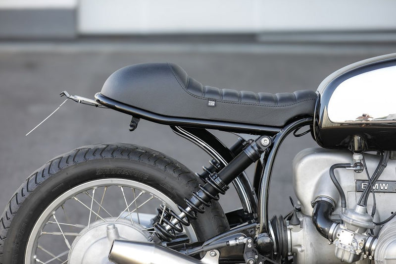 Detail of the BMW Bobber SE Classic Racer showcasing sleek seat design and rear suspension.