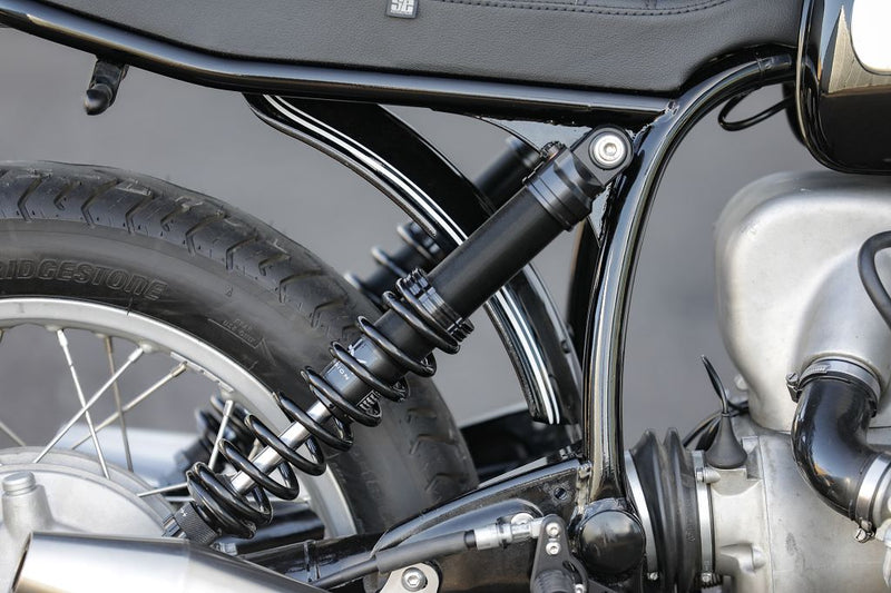 Close-up of the suspension and rear tire of the BMW Bobber SE Classic Racer motorcycle.