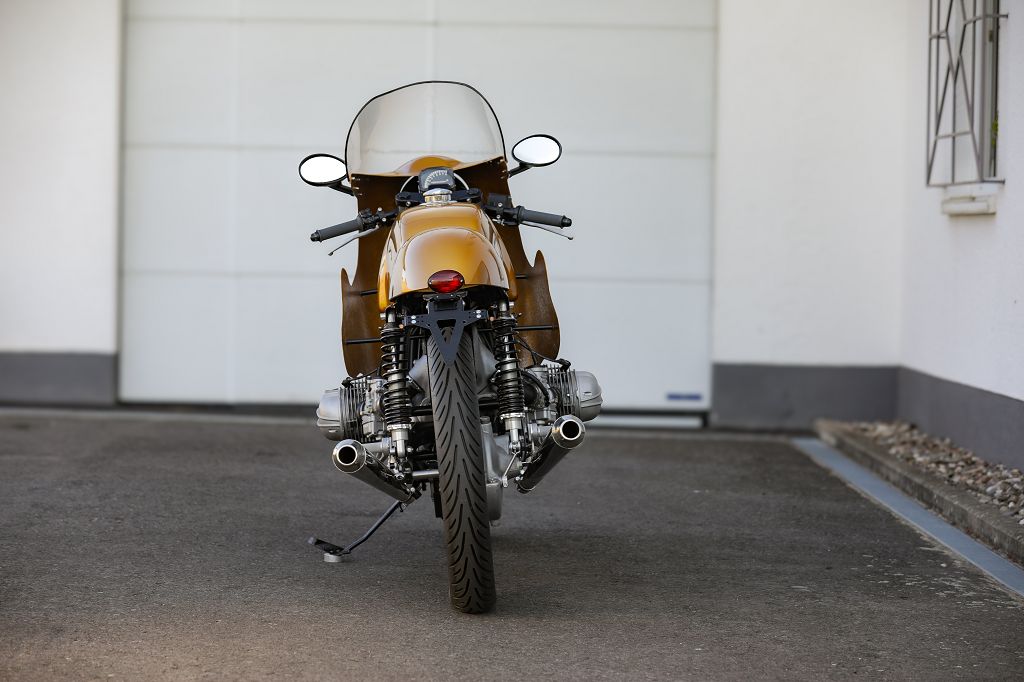 BMW Bobber SE Concept Bike view from the rear showcasing classic racer design and gold accents.