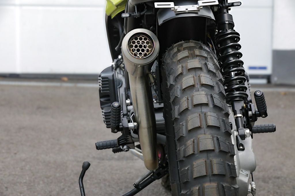 BMW K75 SE Scrambler concept bike rear view showcasing tire and exhaust details.