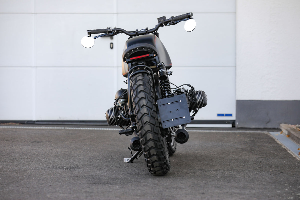 BMW Bobber SE custom bike showcasing a sleek design and powerful silhouette from a rear view.