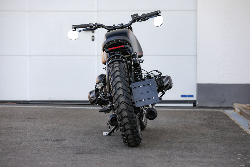 BMW Bobber SE custom bike showcasing a sleek design and powerful silhouette from a rear view.